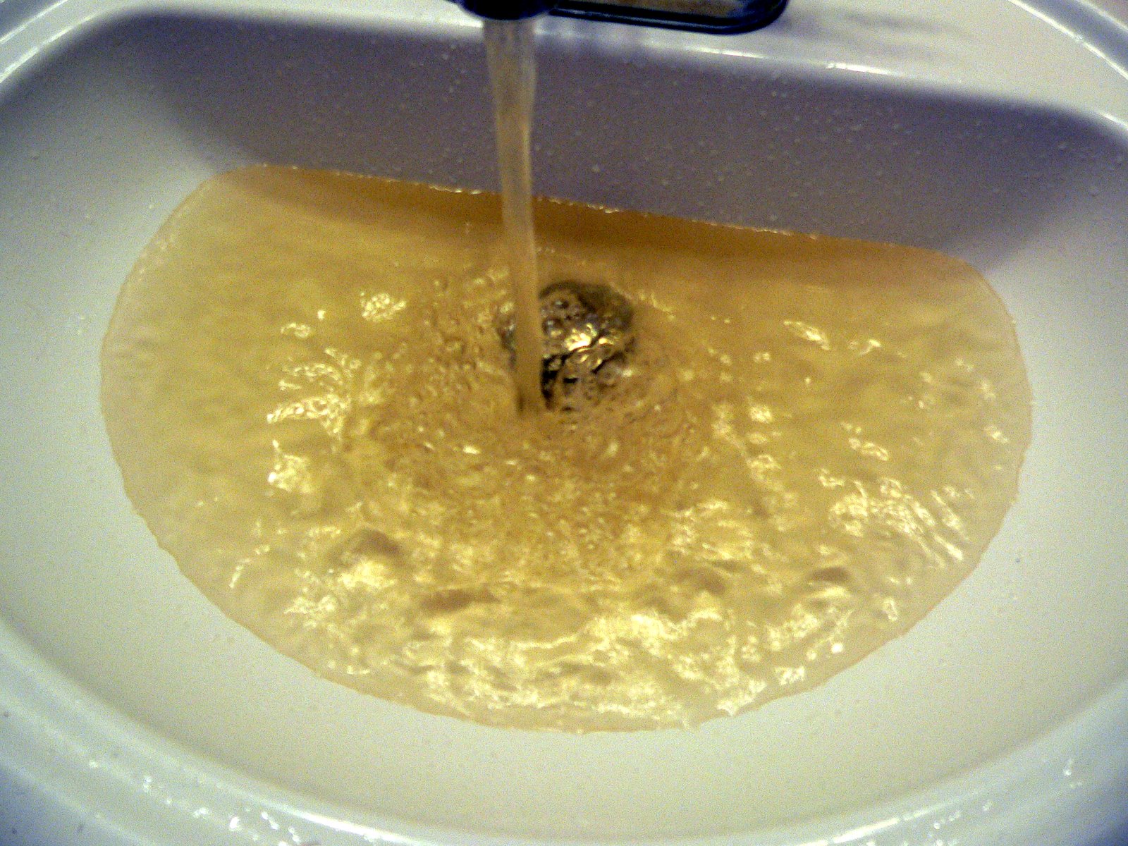 what causes brown water through taps?