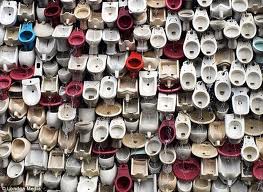 This is a wall of old toilets that is meant to be art in China. It's been dubbed the "Great Wall of China"