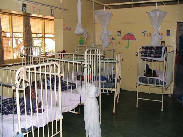 The cots where the orphans slept with their names and stories beside each cot.