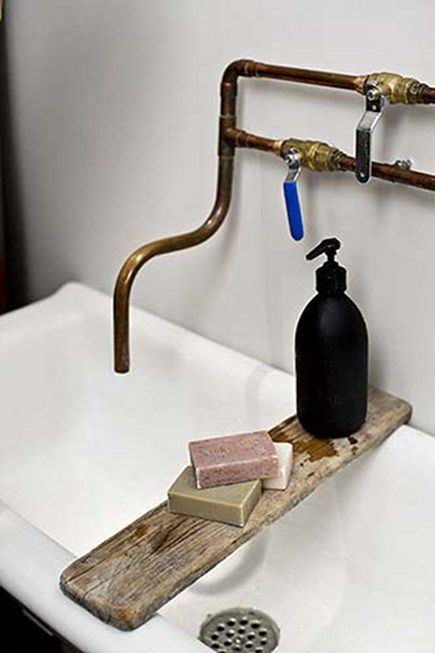 Exposed copper to a white wash basin