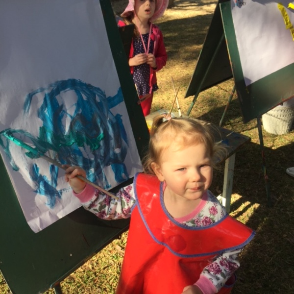 Maggie painting at Kindy