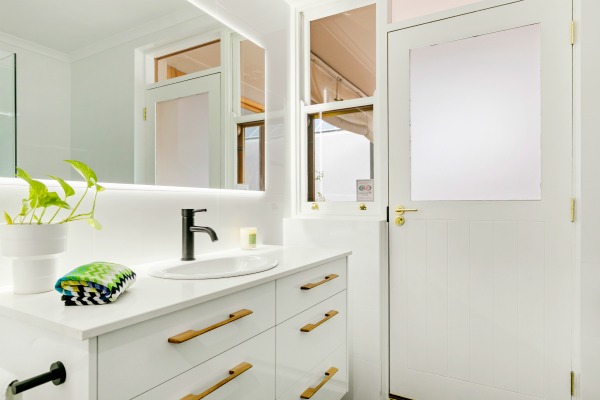 all white bathroom with matte black tapware