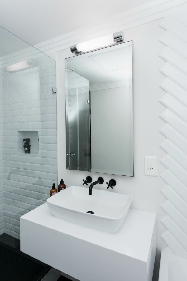 matte black tapware in all white bathroom
