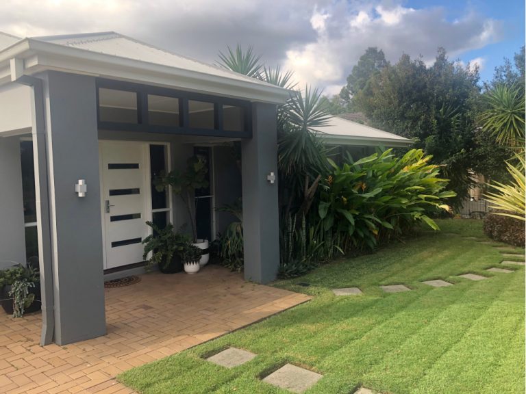 Modern Grey rendered home with tropical plants Grateful for home