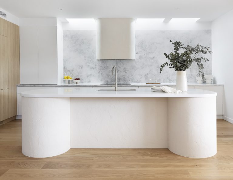 How to choose the right tapware for your home - Meir Mixer tap in curved white kitchen.