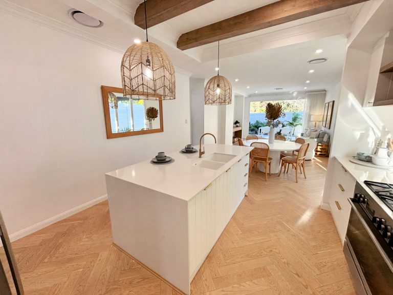 Boho kitchen with brass mixer tap and sink. Necessity of plumber to install kitchen sink